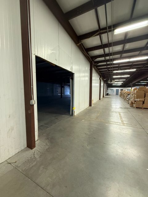 Warehouse passage with wide interior opening