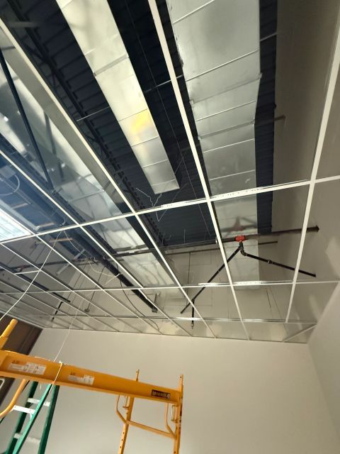 Rectangular ductwork above suspended ceiling grid
