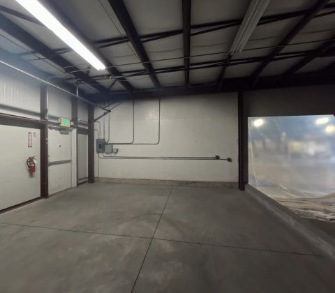 Industrial bay with exposed conduit and steel framing