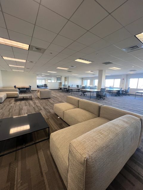 Collaboration lounge with sofas and shared tables