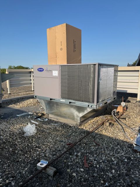 Rooftop HVAC unit on metal curb