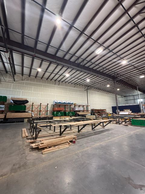 Industrial workshop with high ceiling and worktables