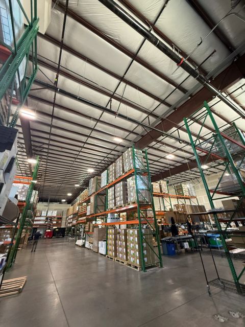 Warehouse storage racks under exposed steel roof